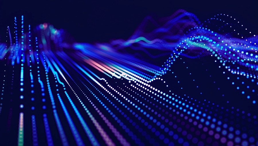 A digital landscape of glowing blue, purple, and pink dots forms abstract waves—a Nurse Assist SaaS Shortlist vision.