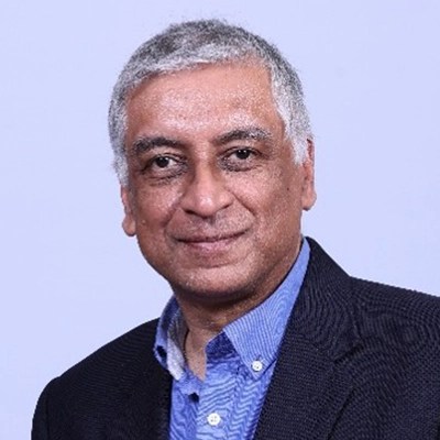 A headshot of a middle-aged man with short grey hair, suited for roles in Healthcare Data or Enterprise Intelligence sectors.